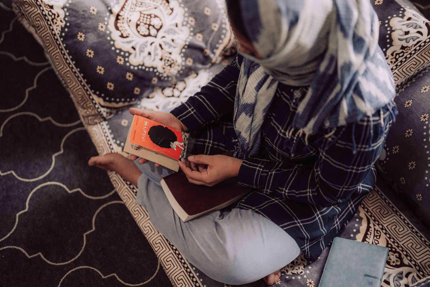 Ariana holding a book
