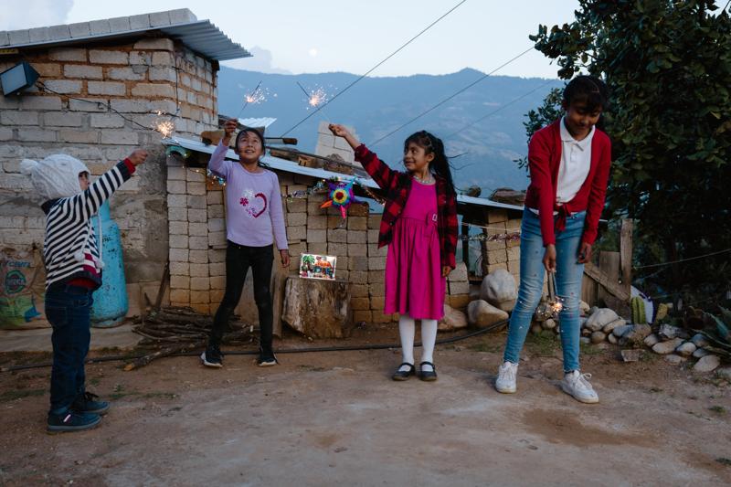 Alicia playing with other children