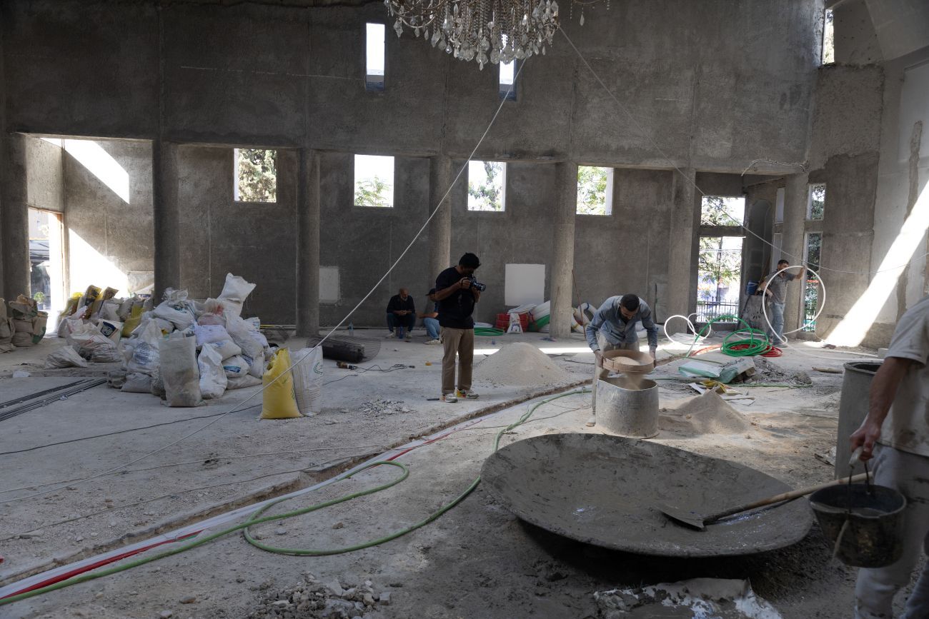 Men working in Saint Elias Church in Damascus in reconstruction after attack